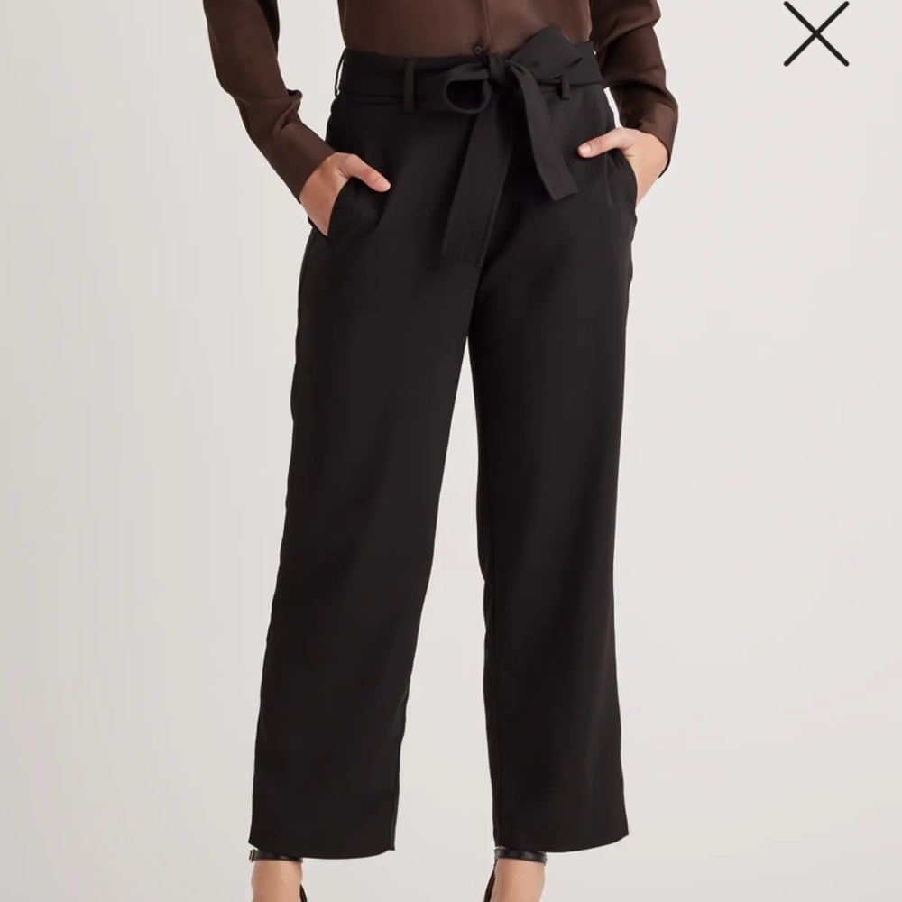 Express high ride trousers with belt that ties in front.